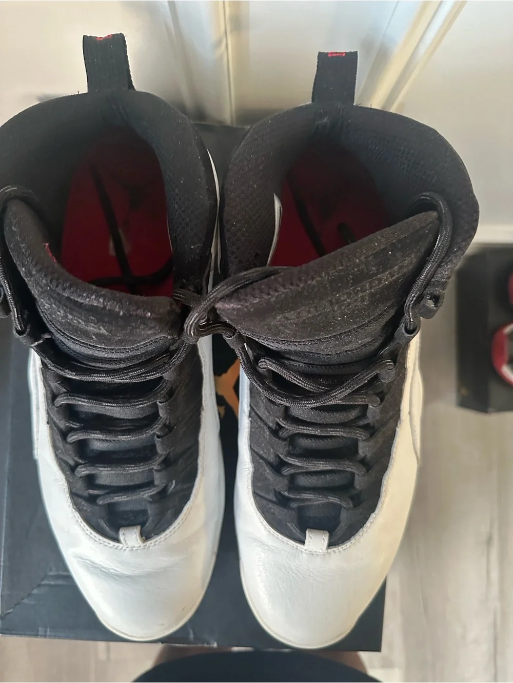 Jordan Black and White High-Top Sneakers with Red Liner